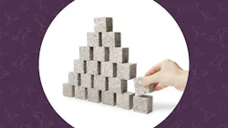 Unstable. Hand removing one block of a pyramid made of small granite rock blocks. Unstable. Hand removing one block of a pyramid made of small granite rock blocks.