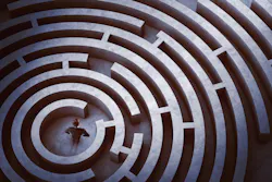 Businessman at the center of a maze Businessman at the center of a maze