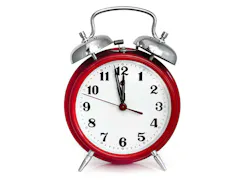 Old red alarm clock, showing two minutes to midnight. Isolated on white. Old red alarm clock, showing two minutes to midnight. Isolated on white.