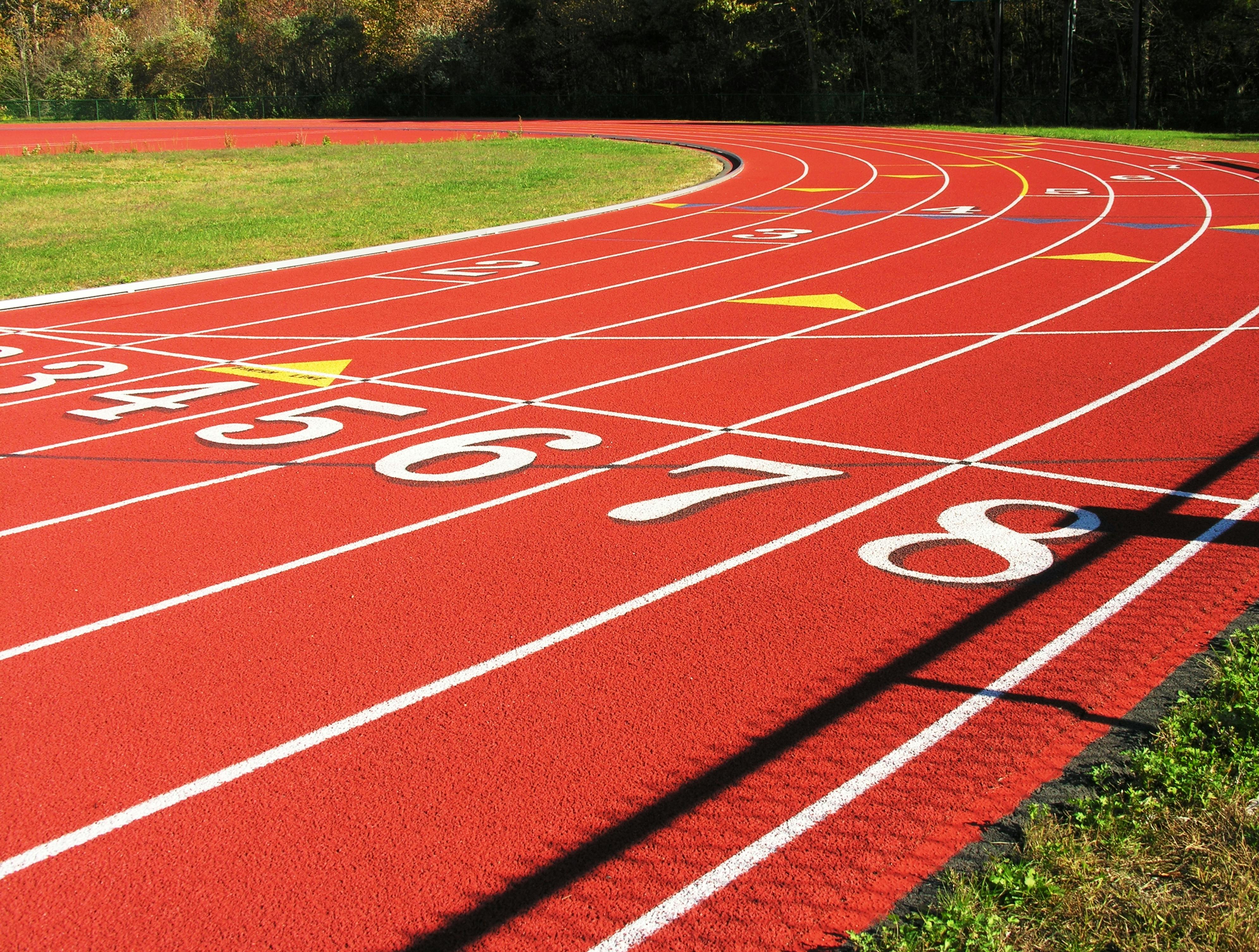 Running track turn. Running track turn with numbered lanes.