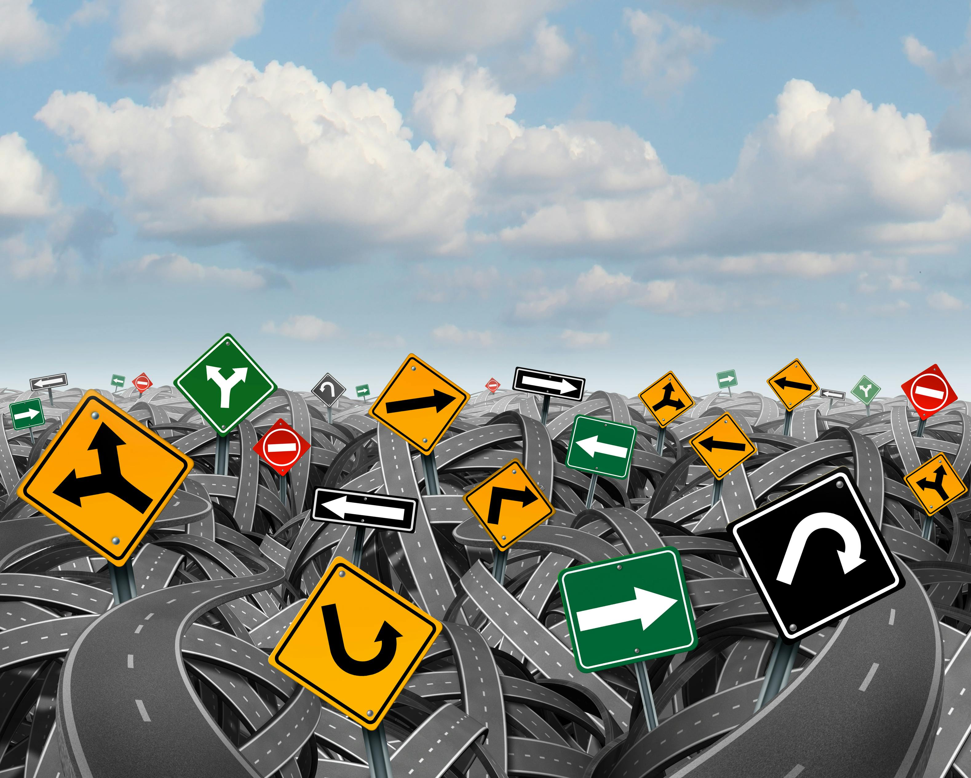 Direction uncertainty with a landscape of confused tangled roads and highways and a group of traffic signs competing for influence as a symbol of the challenges of planning a strategy for success.