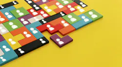 Image of tangram puzzle blocks with people icons over wooden table