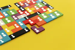 Image of tangram puzzle blocks with people icons over wooden table