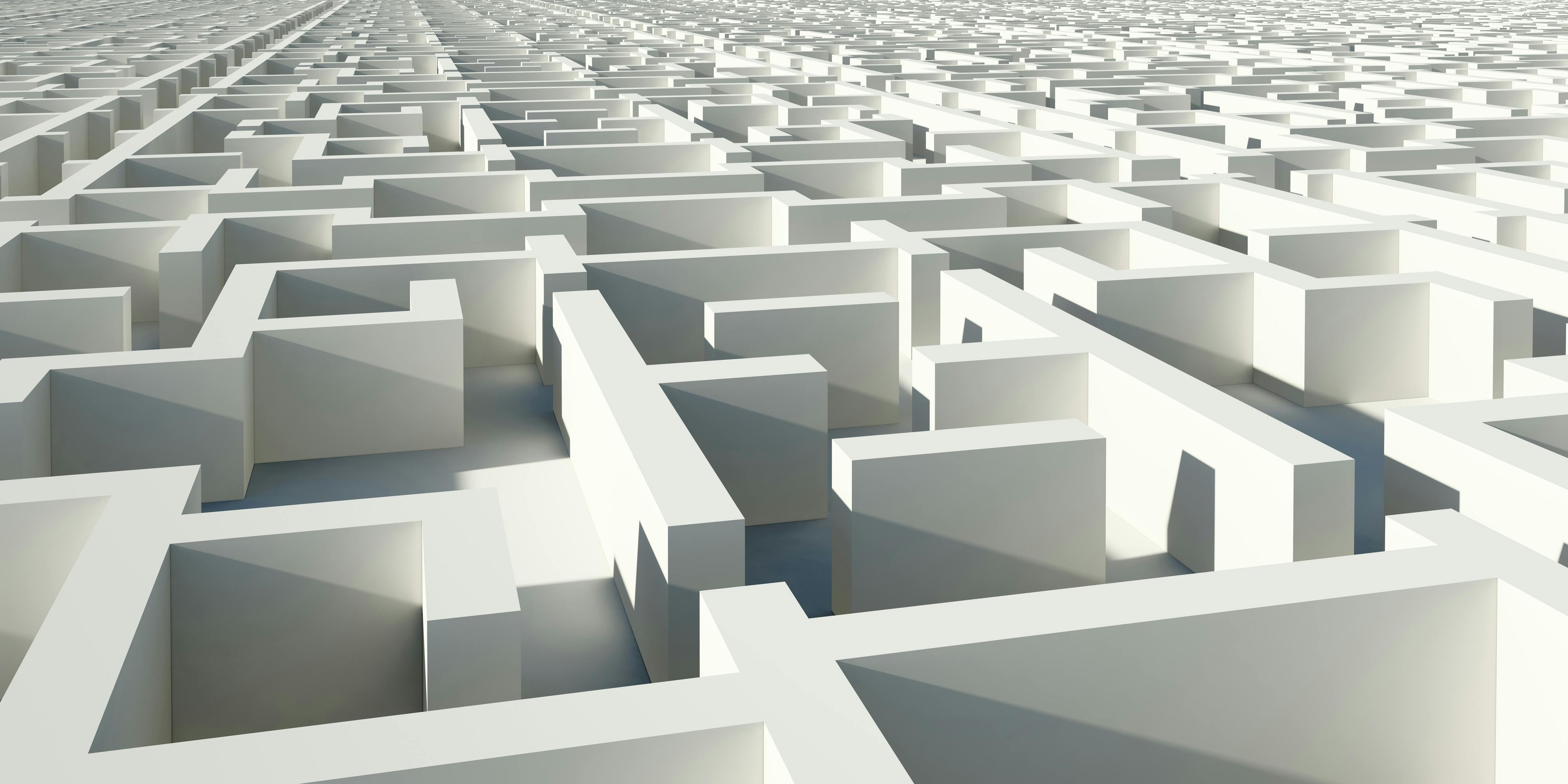 Image of figure sitting in maze