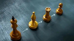 Line of chess pieces and arrows as a concept of succession planning.