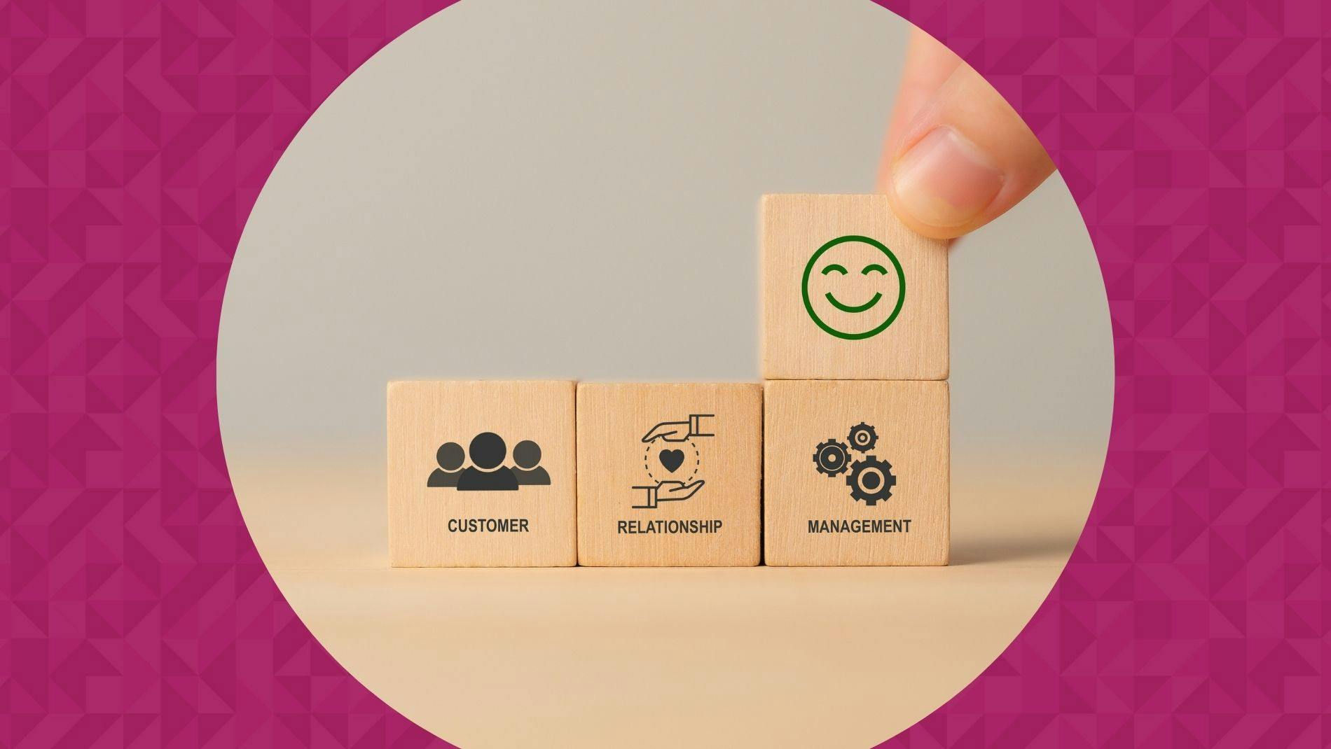 Wooden cube blocks with CRM symbols on minimal background