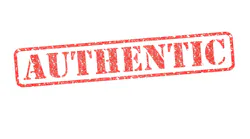 AUTHENTIC red rubber stamp over a white background.