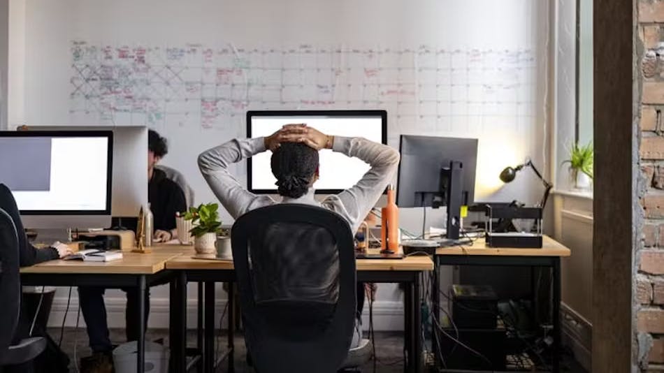 Female working from her home office staring at her computer screen.