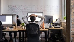 Female working from her home office staring at her computer screen. Female working from her home office staring at her computer screen.