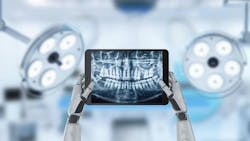Concept image of robot hands holding dental x-rays at the dentist's office. Concept image of robot hands holding dental x-rays at the dentist's office.