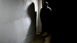 Silhouette of scary hooded criminal in the shadows. Silhouette of scary hooded criminal in the shadows.