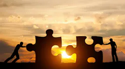 Concept of solving a problem with a silhouette of two men connecting puzzle pieces at sunset. Concept of solving a problem with a silhouette of two men connecting puzzle pieces at sunset.