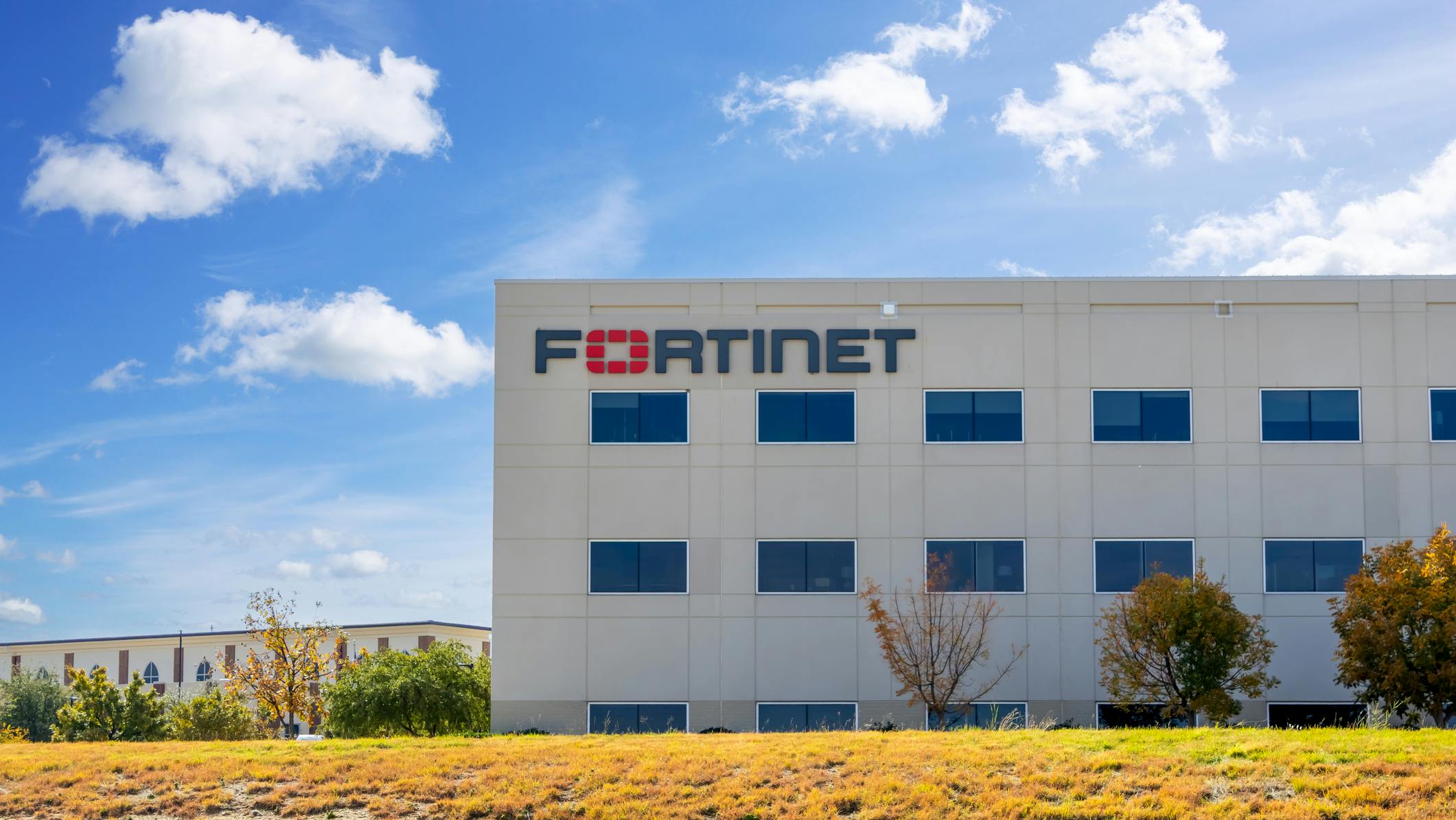 Fortinet technical center building on a sunny day in Frisco, Texas.