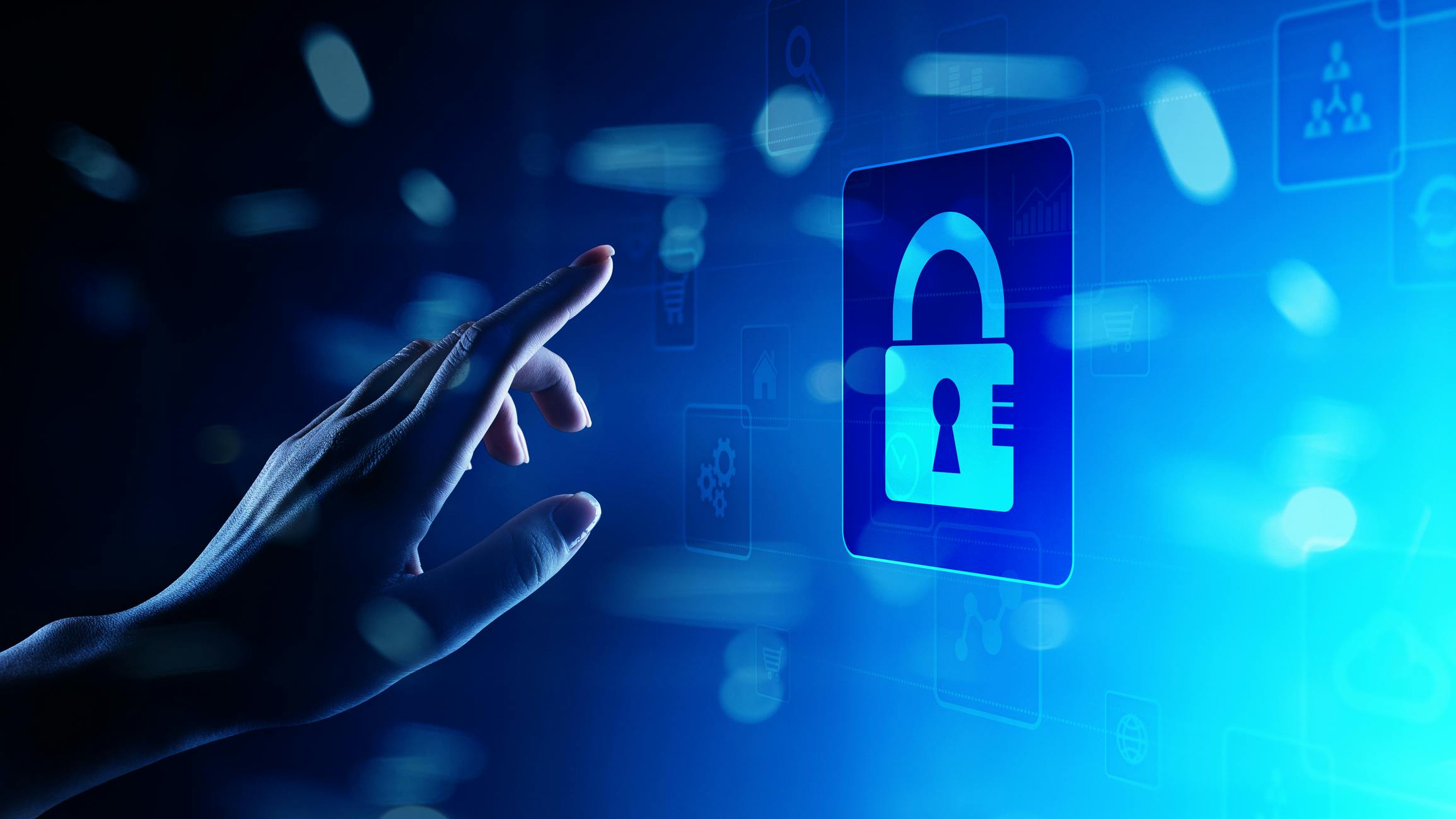 Woman&rsquo;s finger reaching for padlock icon on blue screen representing cybersecurity.