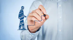 A man drawing a virtual man walking up virtual stairs, representing progress. A man drawing a virtual man walking up virtual stairs, representing progress.