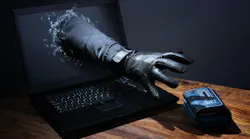 Concept of network hacker reaching arm through a laptop to steal a purse.