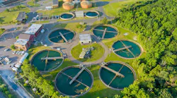 Aerial top view of a city wastewater treatment plant with recirculation sediment tanks.