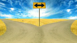 Drawing of a fork in the road split by a road arrows sign with blue sky and countryside landscape.