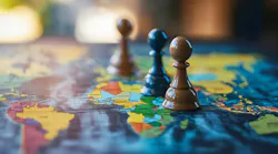 Wooden pawns on a world map symbolizing geopolitical strategy, economic control, sanction pressure, and political power.