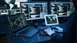 Young professional female with a lot of information on multiple screens.
